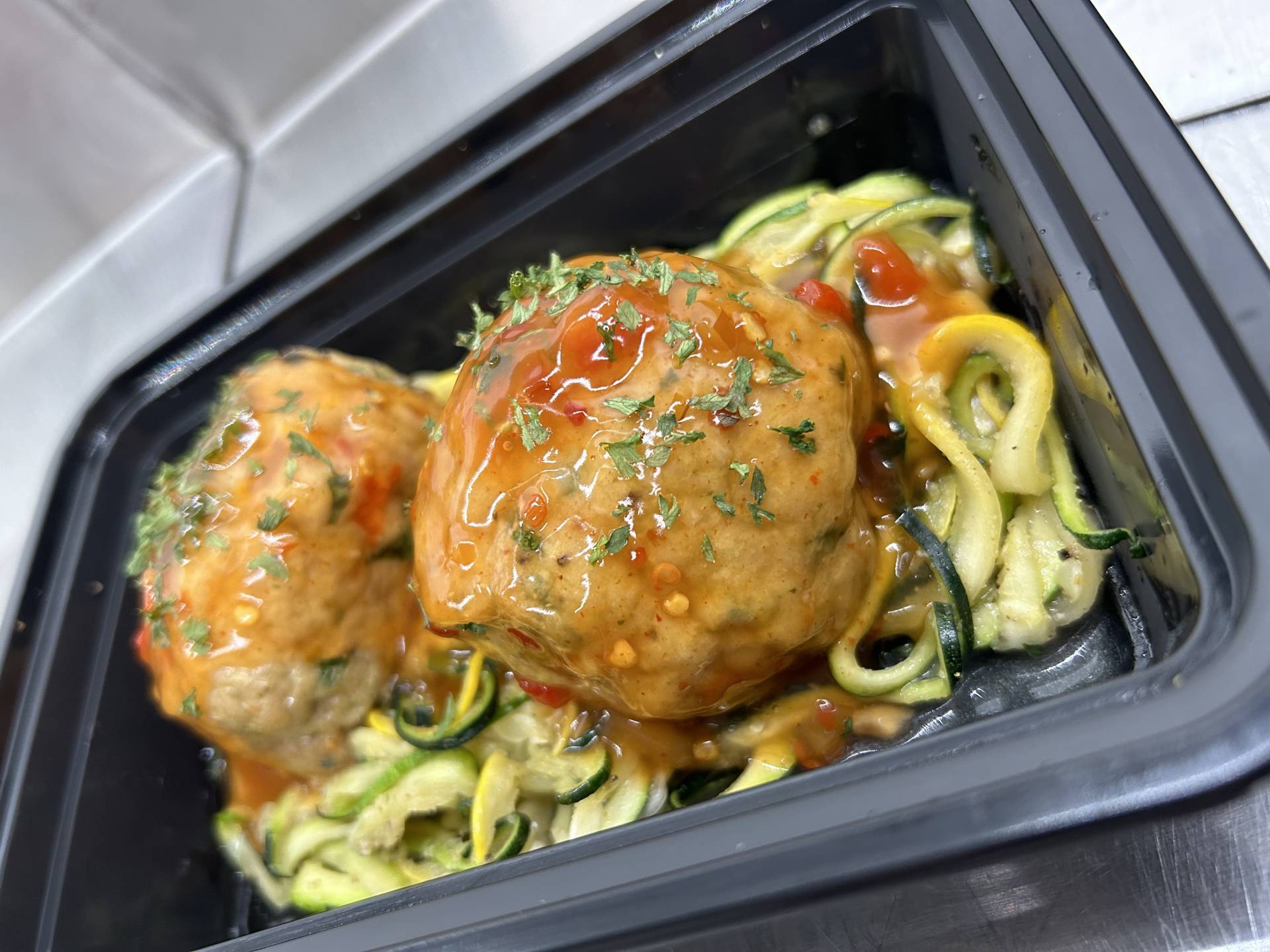 Chicken Thai Meatballs Stuffed w/Bok Choy On A Bed of Zoodles